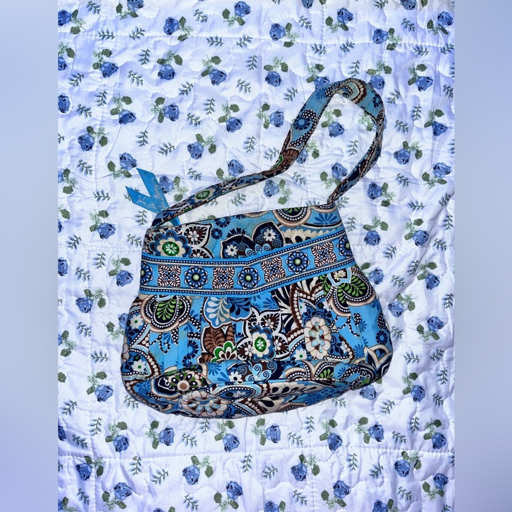 Small, blue Vera Bradley purse.
